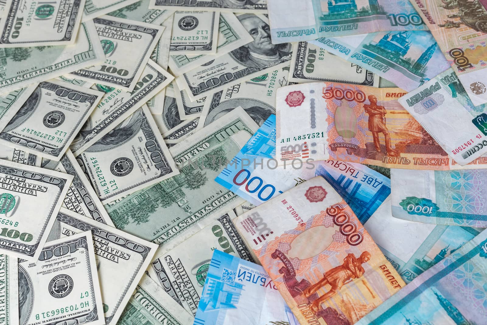 russian rubl and us dollar banknotes close-up with selective focus and blur
