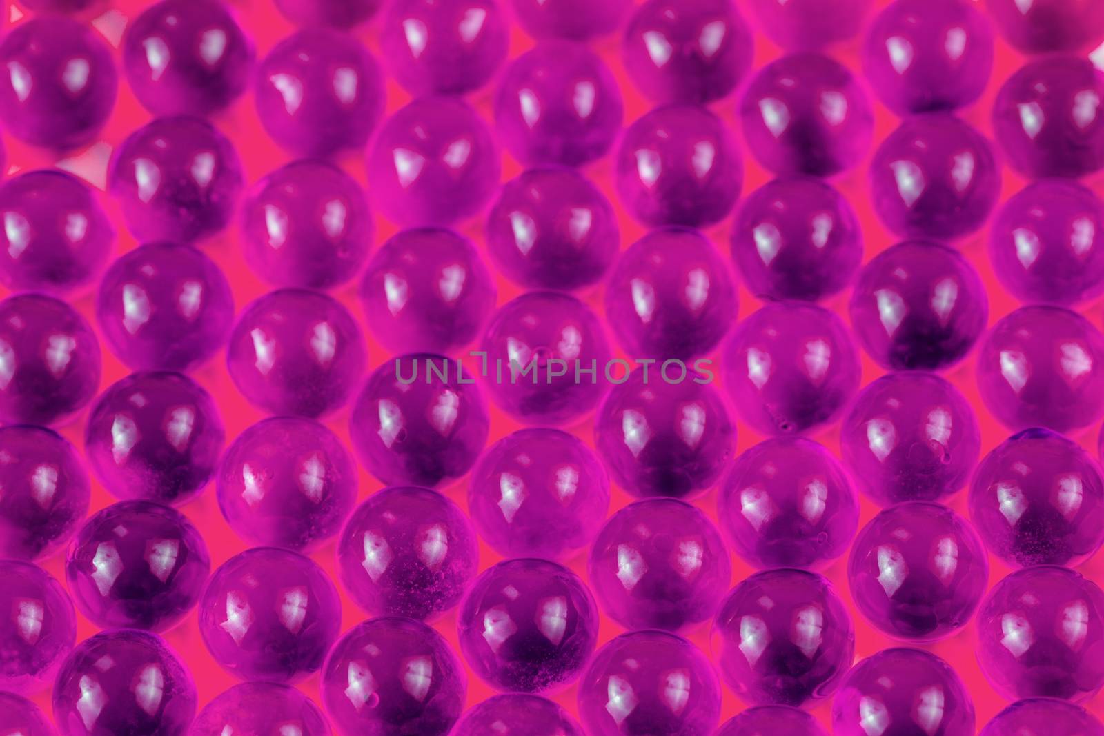 proton purple spherical ball capsules selective focus weird abstract background.