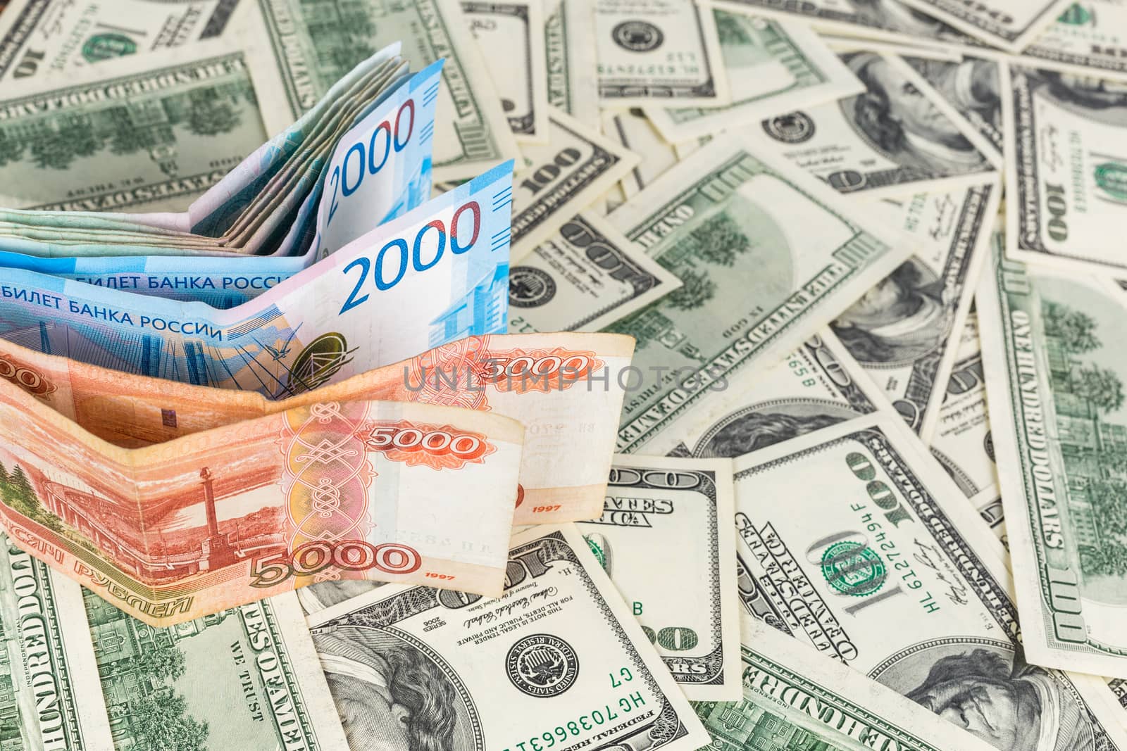 russian rubl and us dollar banknotes close-up with selective focus and blur