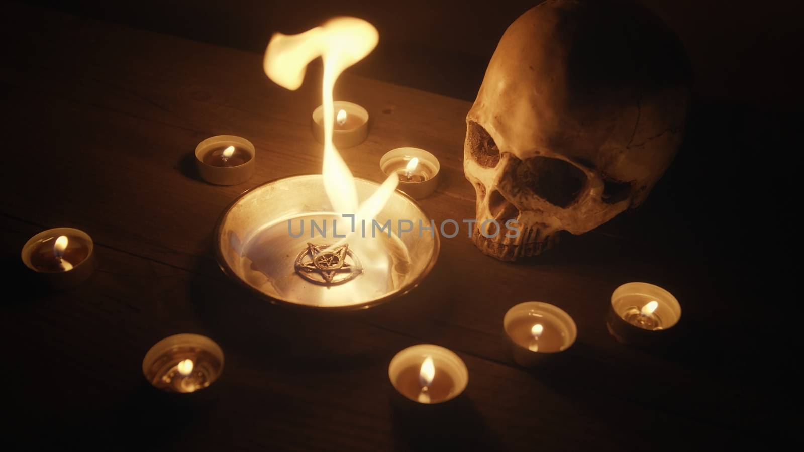 Burning pentacle on altar closeup photo by svedoliver