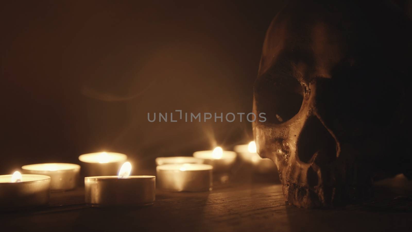 Candles and skull closeup photo by svedoliver