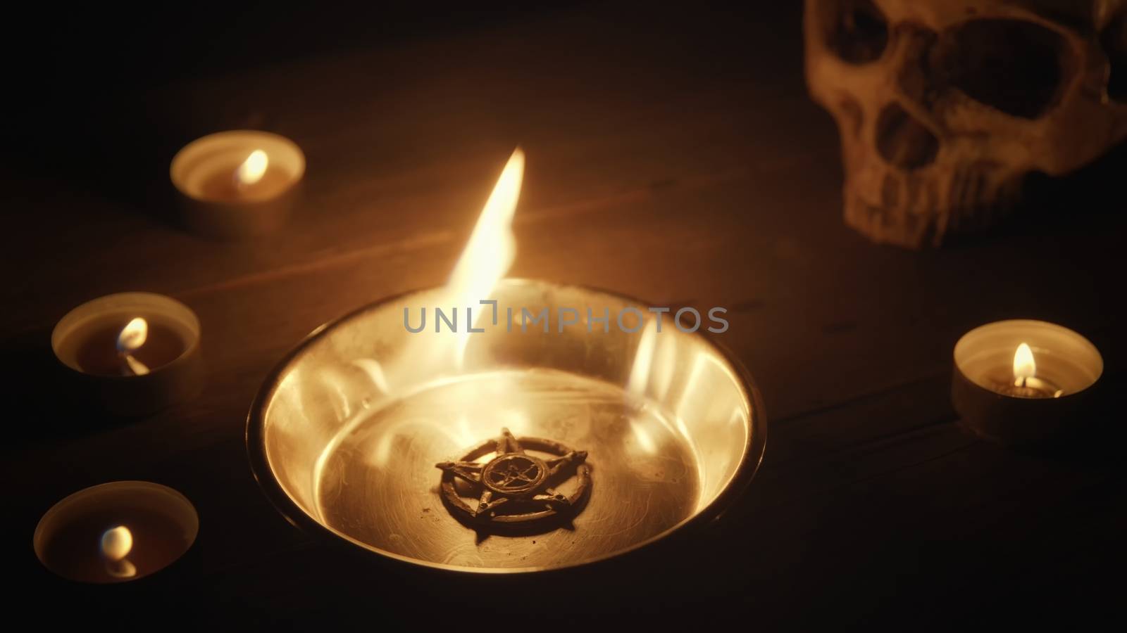 Burning pentacle on altar closeup photo by svedoliver