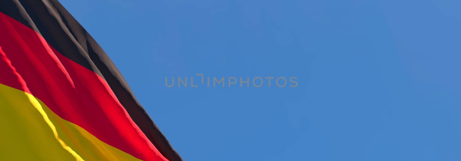 3D rendering of the national flag of Germany waving in the wind against a blue sky