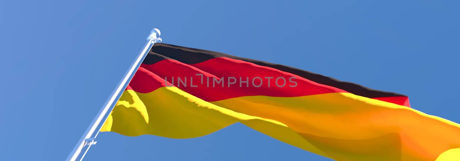 3D rendering of the national flag of Germany waving in the wind against a blue sky