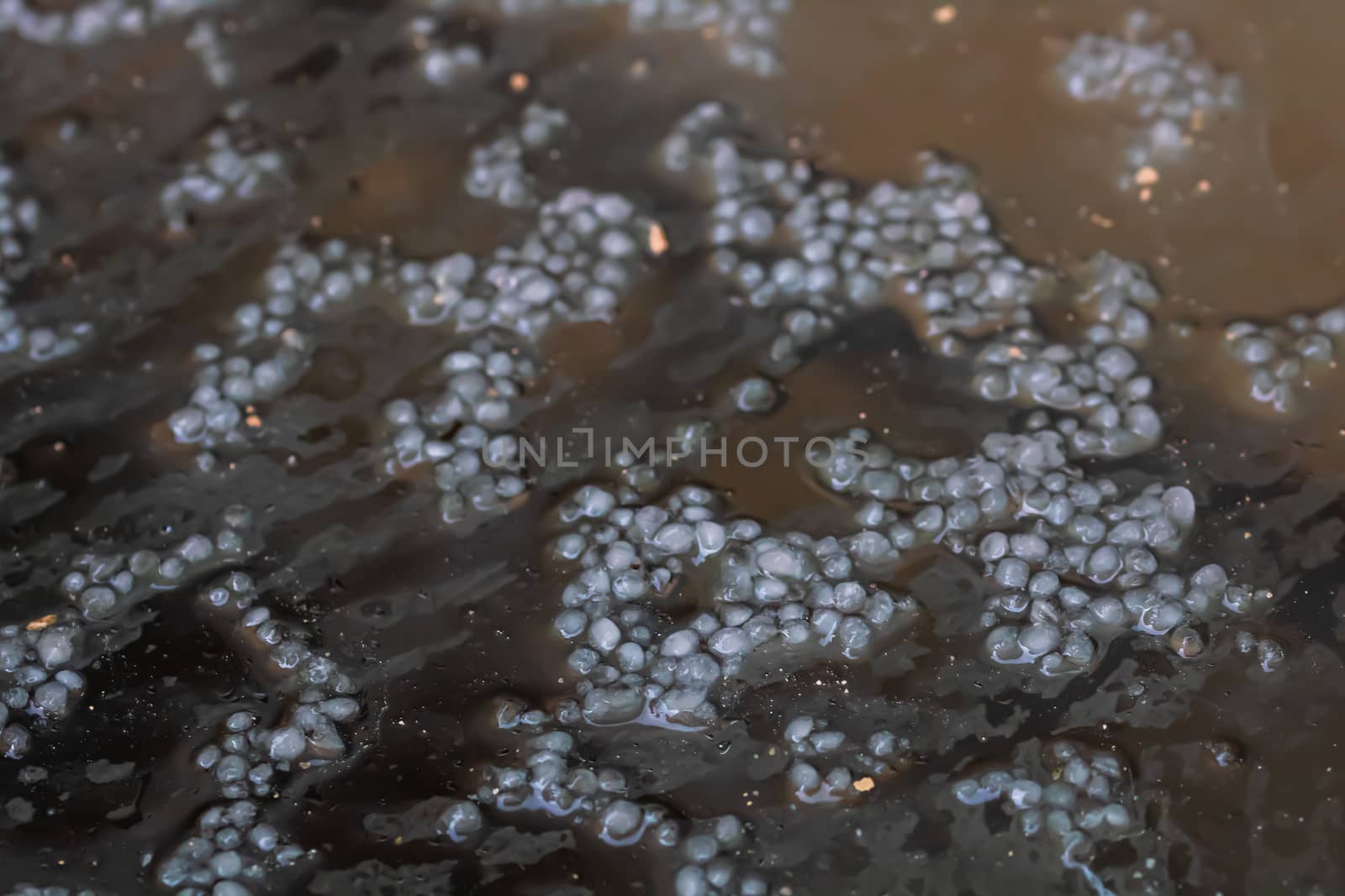 Close up of hailing, selective focus on small hail balls.