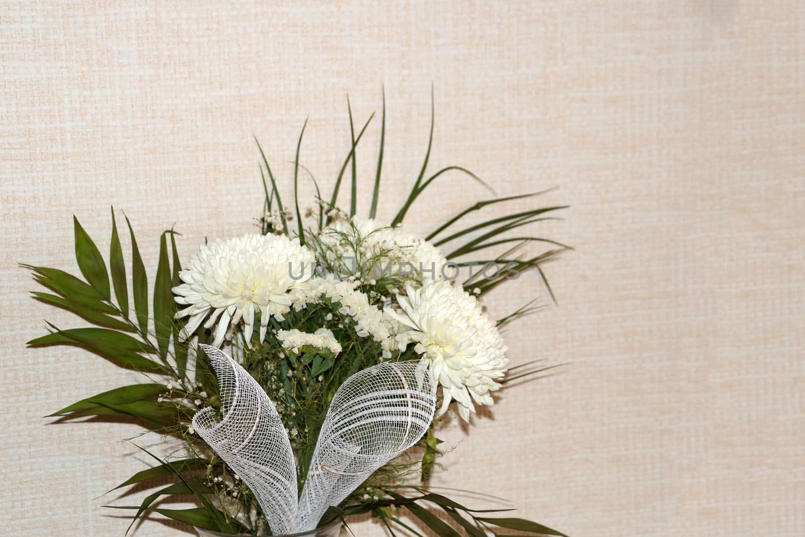 bouquet of white chrysanthemums on a light background, copy space.