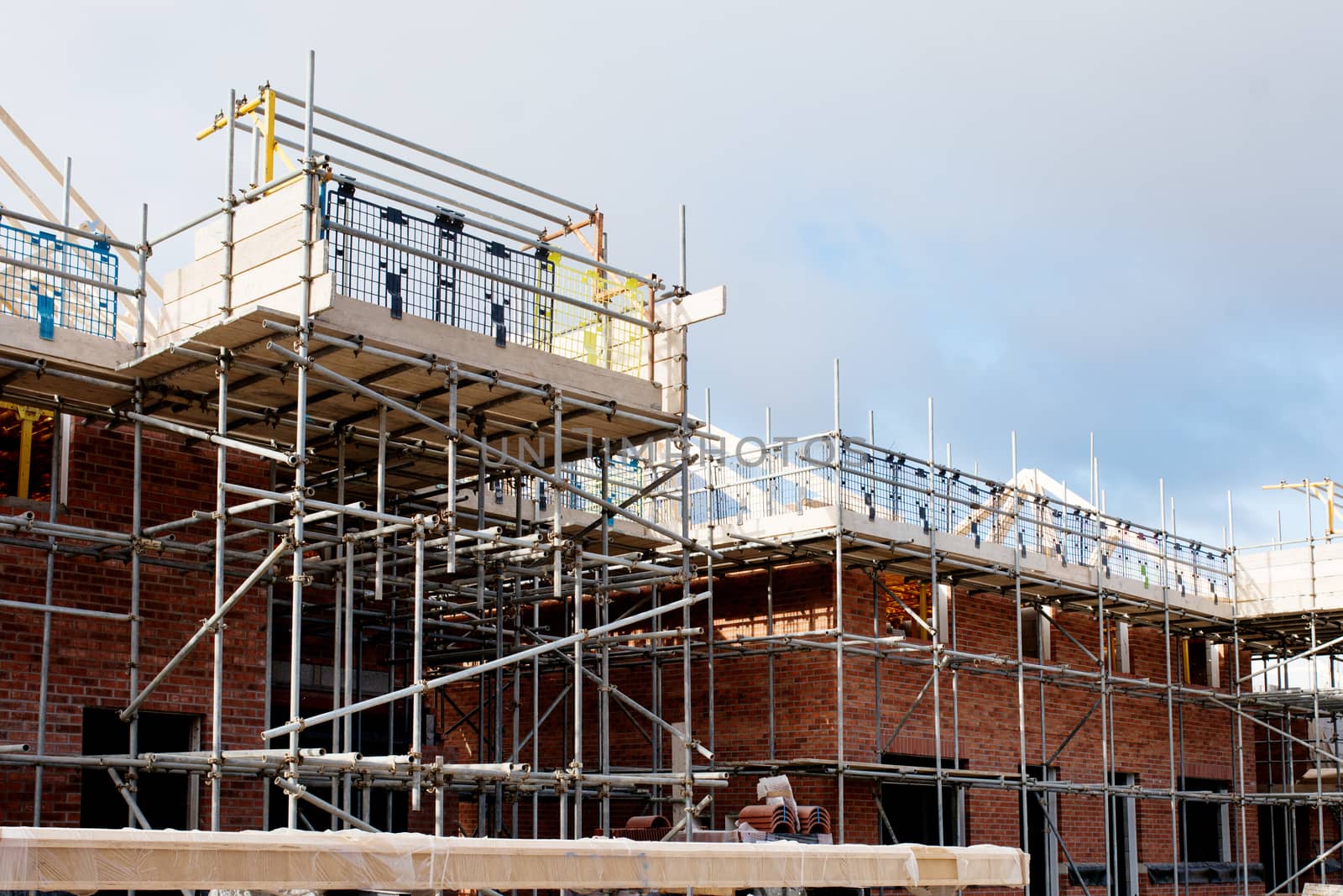 Loading platform made of scaffold system on housing development construction site