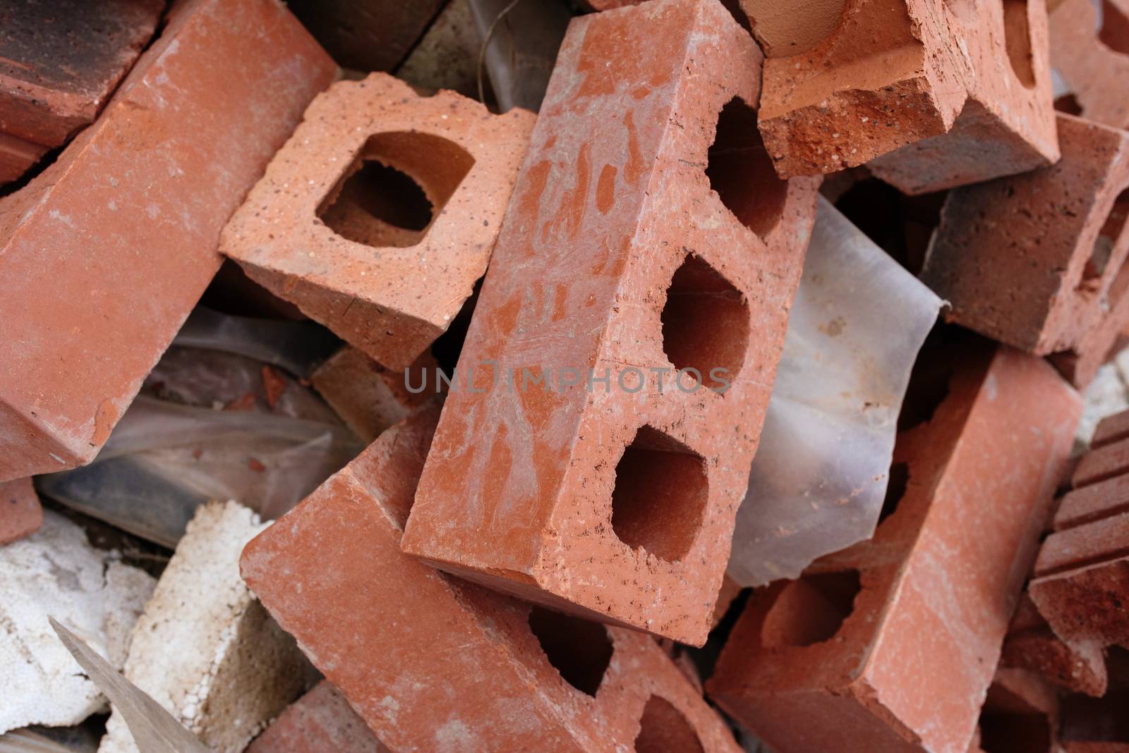 A pile of red bricks on the construction site