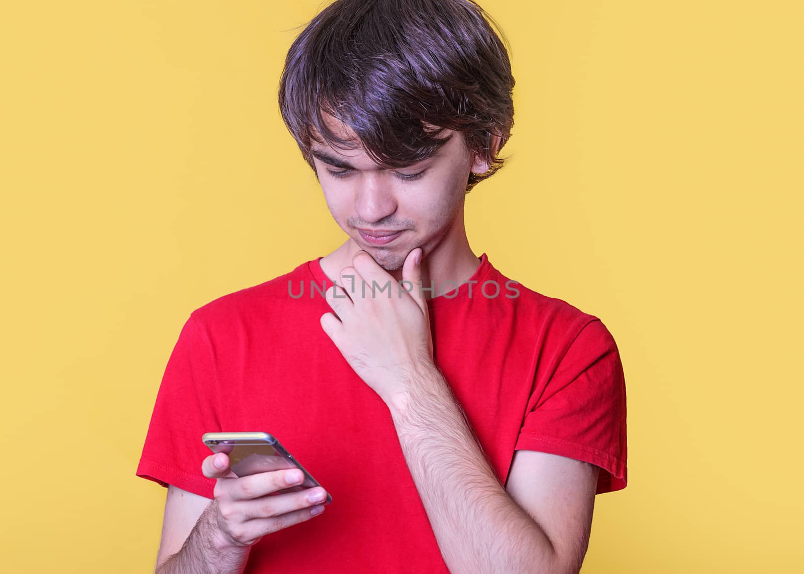 Boy in red shirt chating on phone
