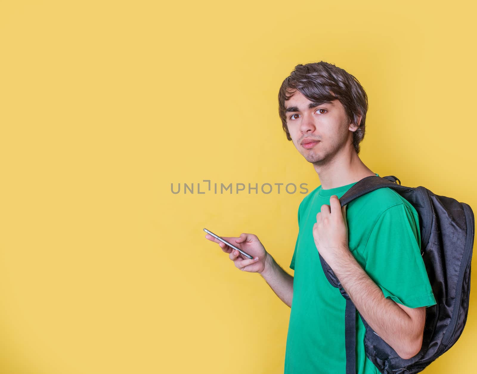 A young man in red shirt chatting on the phone