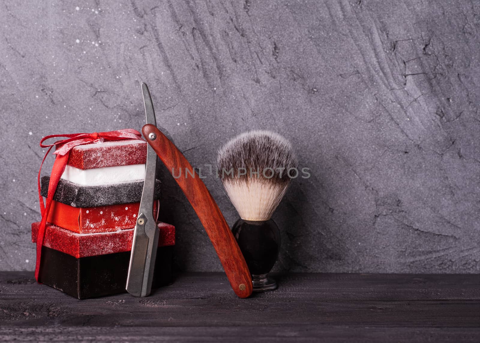 Razors, brush, christmas gift on a wood background