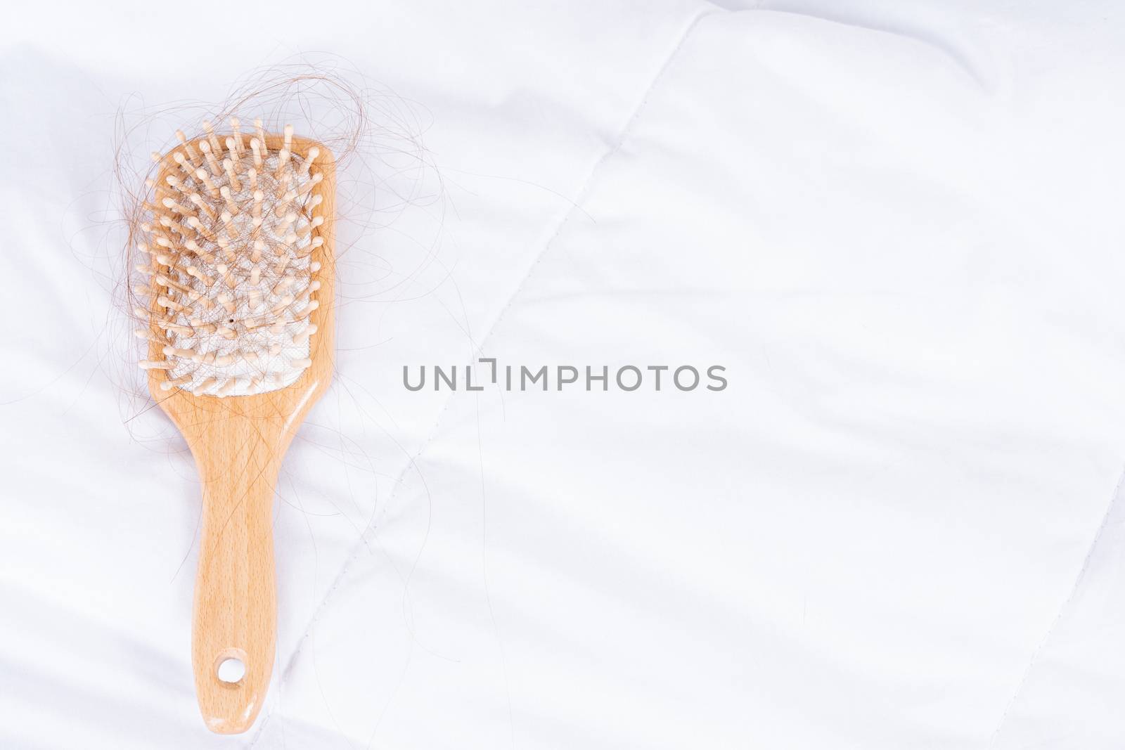 Hair fall problem, closeup comb with problem hair. Healthcare medical or daily life concept.