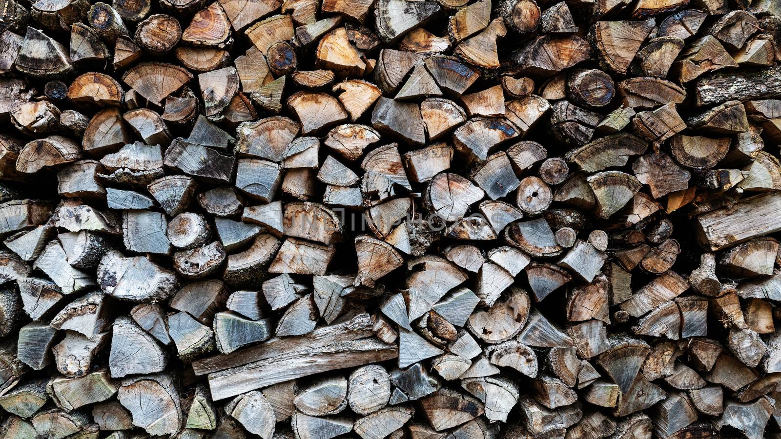 Stack of firewood, chopped firewood background.