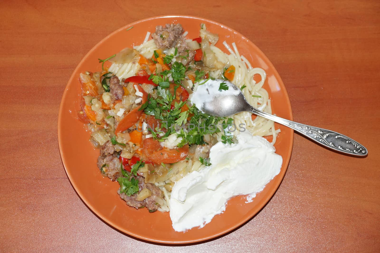 vegetable stew with meat and sour cream in a plate by Annado