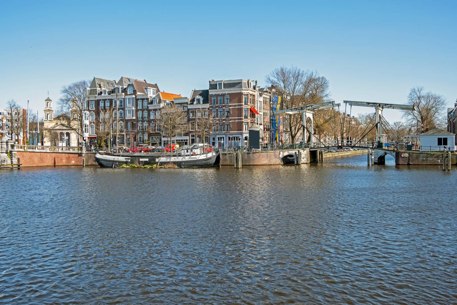 City scenic from Amsterdam at the river Amstel in the Netherlands