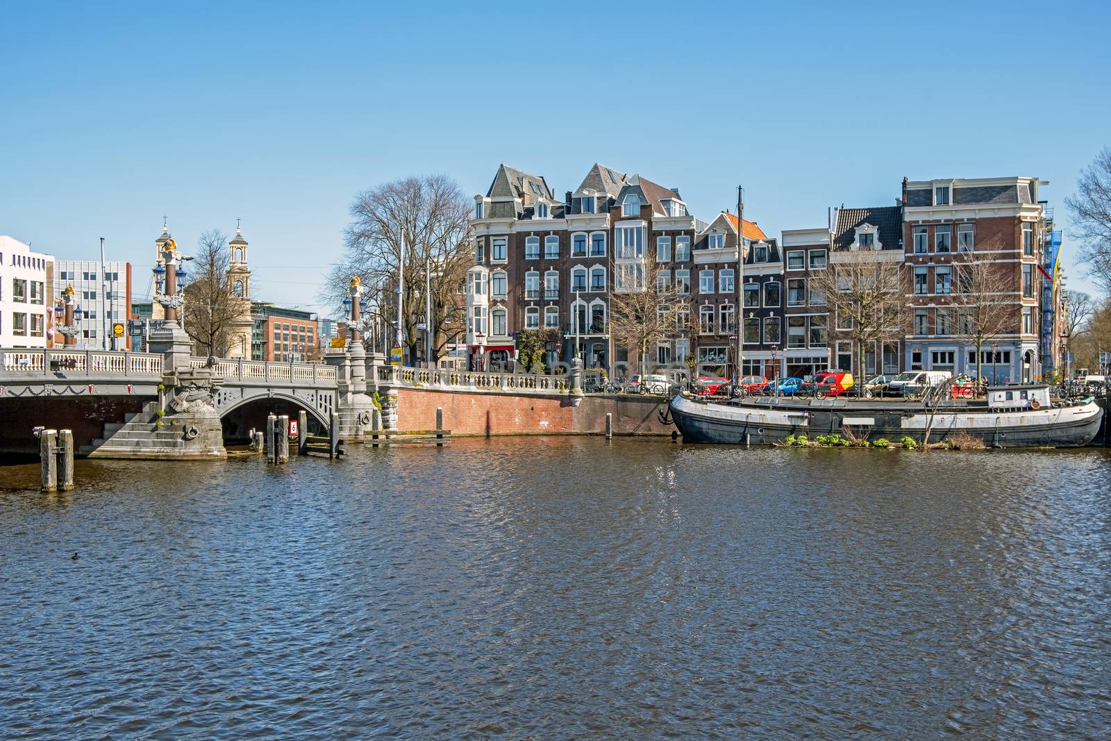 City scenic from Amsterdam at the river Amstel in the Netherlands