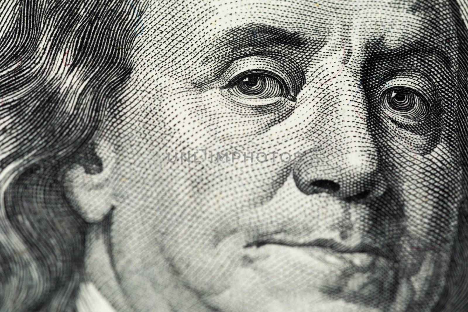 A close view of engraving portrait of Ben Franklin of old one hundred us dollars banknote. Selective focus with natural lens blur.