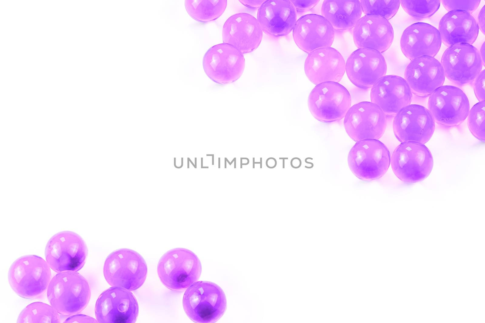 proton purple spherical ball capsules with selective focus isolated on white background.