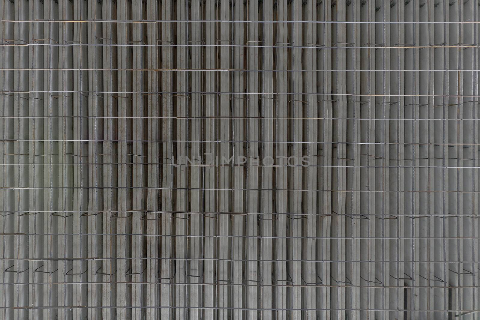 Large flat profiled sheet armature reinfoced floor before concrete fill. Flat rectangular texture.