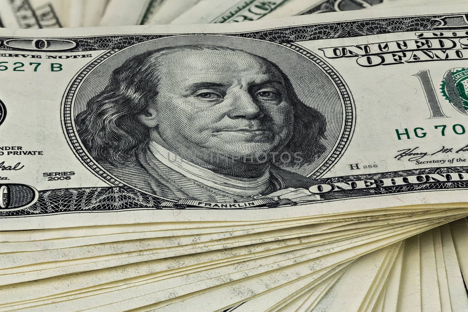 a skewed stack of old us dollar banknotes - close shot.