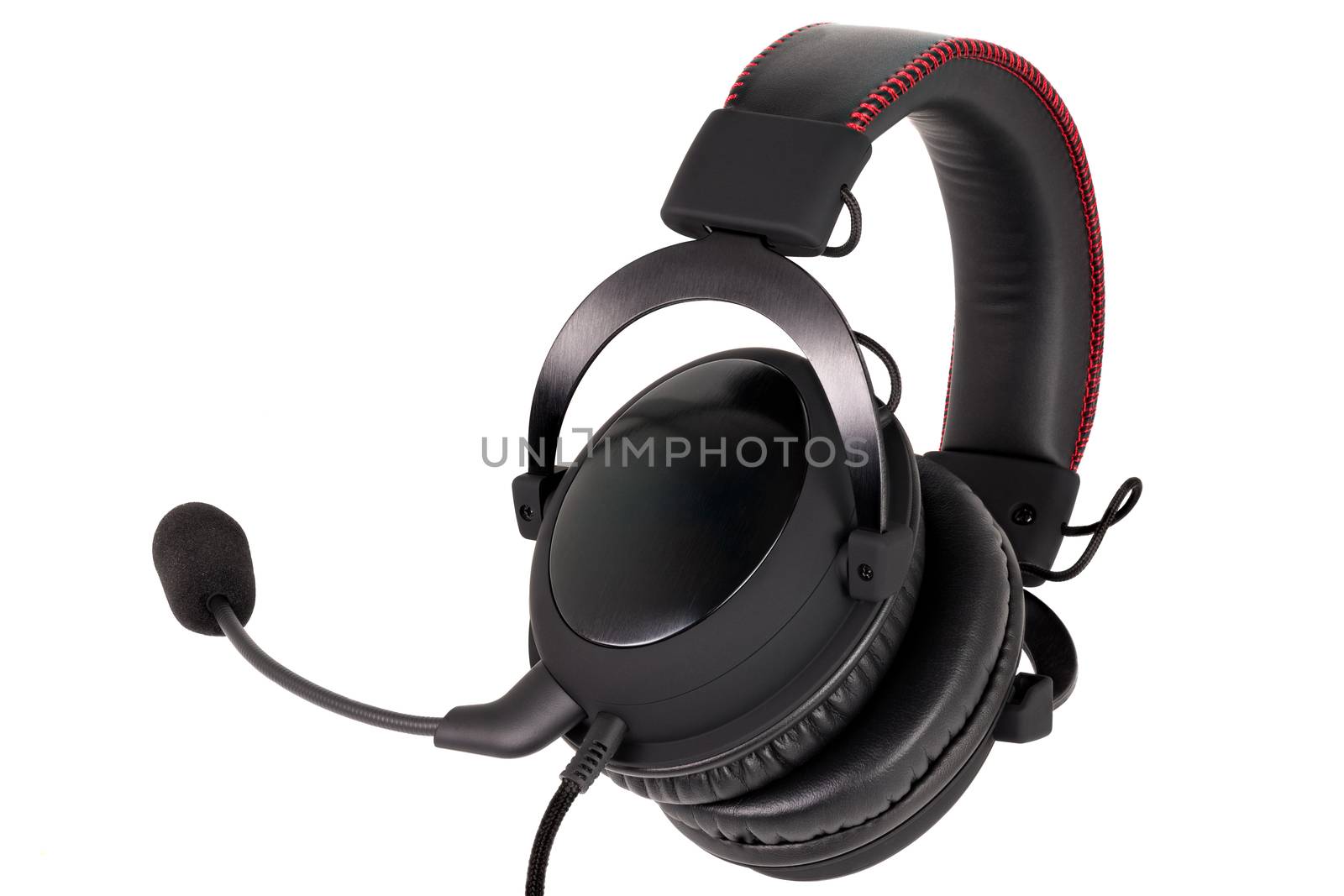 close view of wired black gaming headphones with microphone isolated on white background.