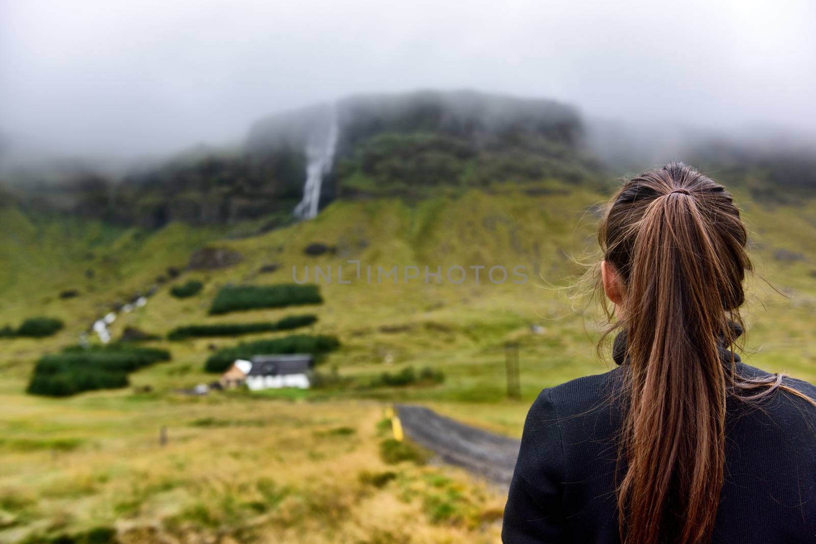 Iceland hiking tourist hiker sightseeing visiting looking at Raudfeldsgja Canyon gorge rift nature landscape on the Snaefellsnes peninsula, West Iceland by Maridav