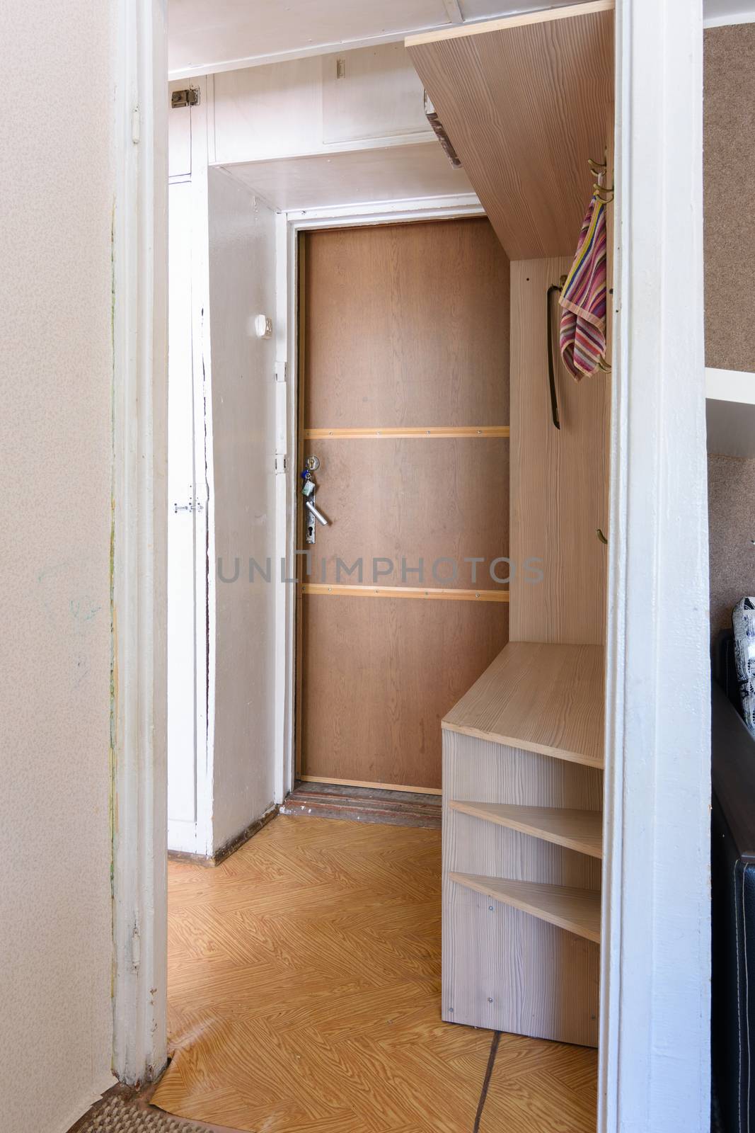 Entrance hall in a small apartment with an outdated interior