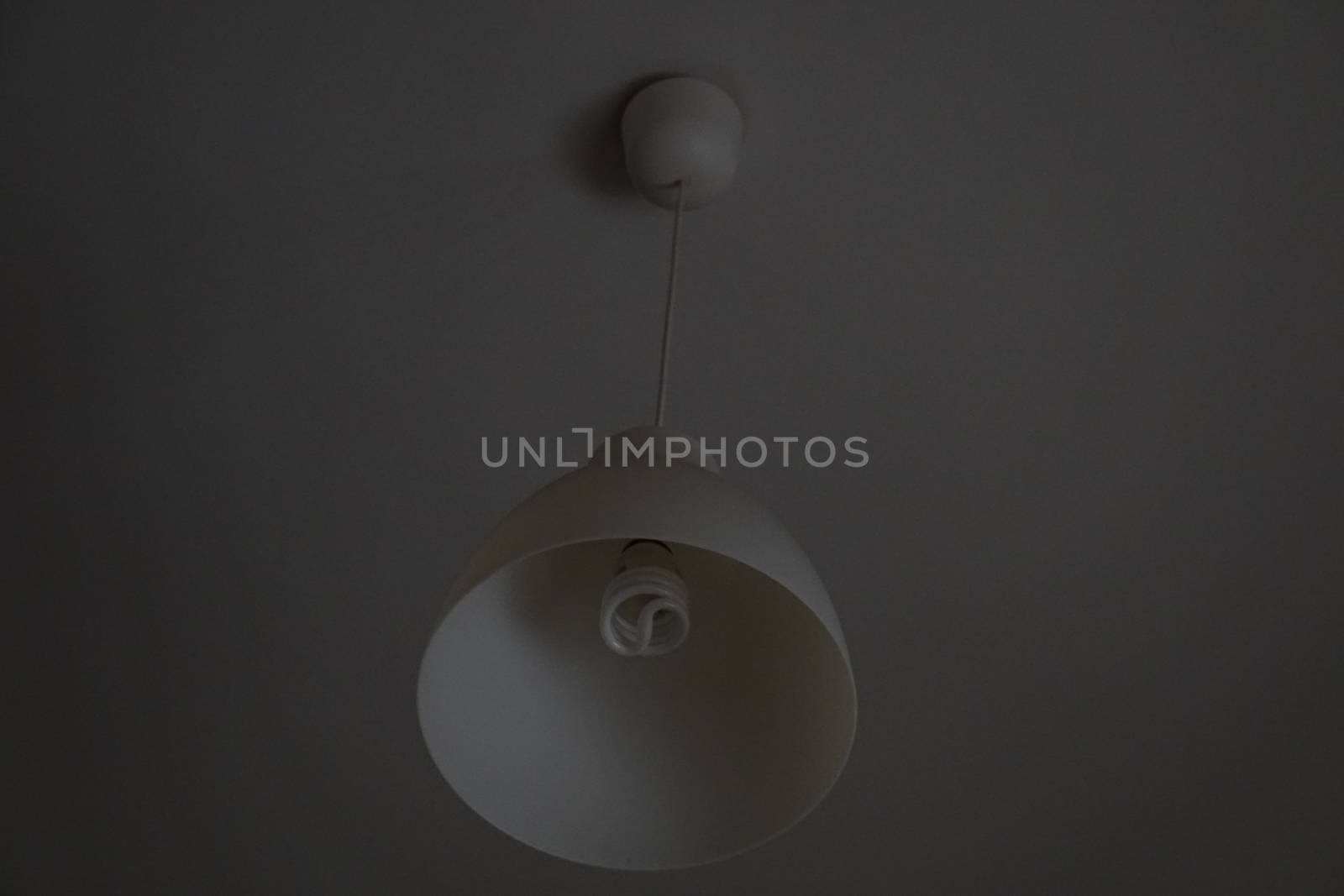 a white lamp fixed in the ceiling by devoxer