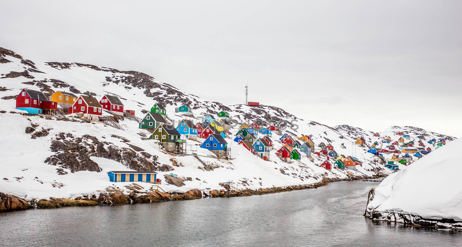 Colorful arctic village houses at the rocky fjord  in the middle of nowhere, Kangamiut, Greenland