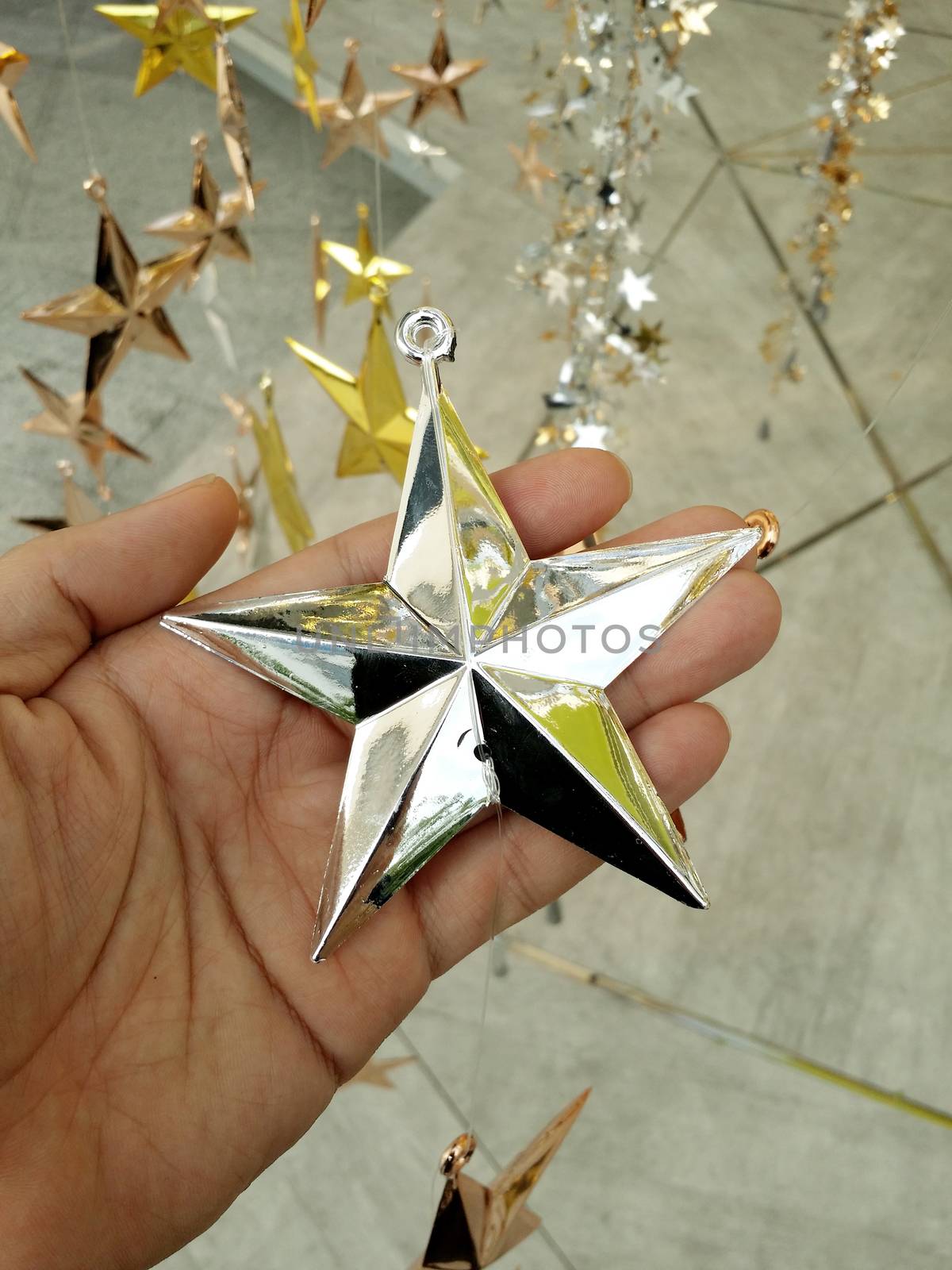 Man Hand and decoration star and Merry Christmas and Happy new years.