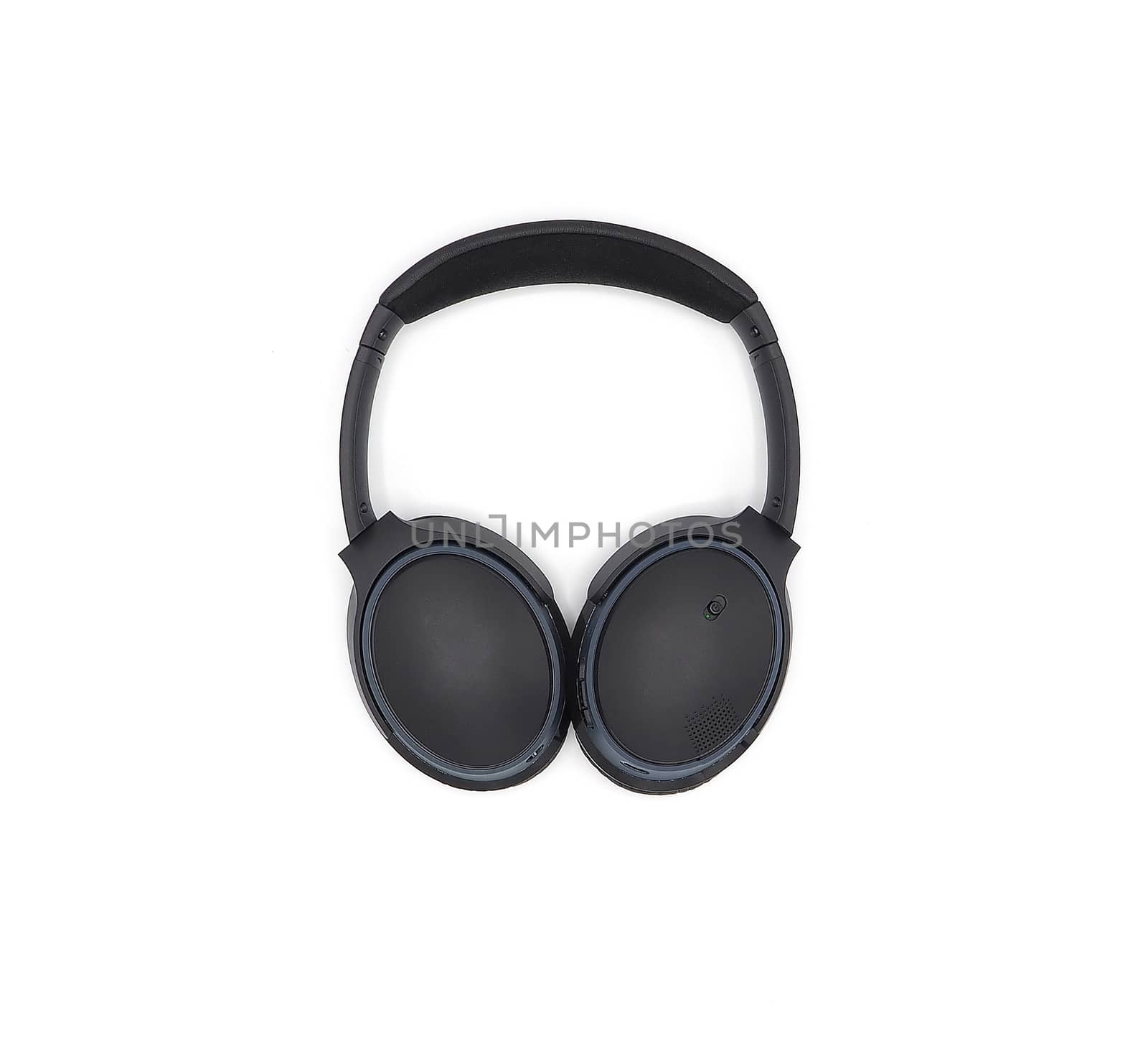 Black wireless headphone around ears and white background and isolated.