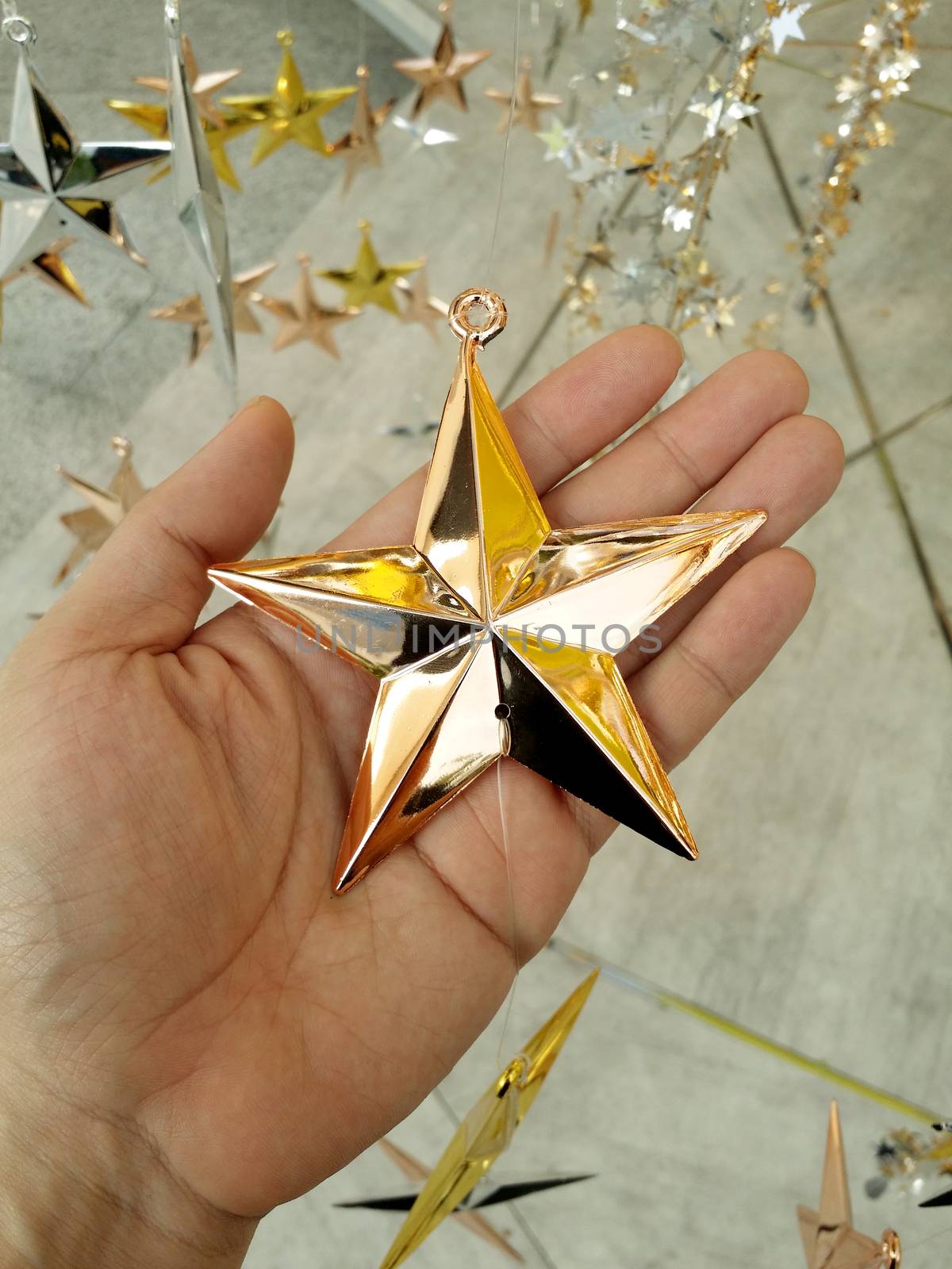 Man Hand and decoration star. by gnepphoto