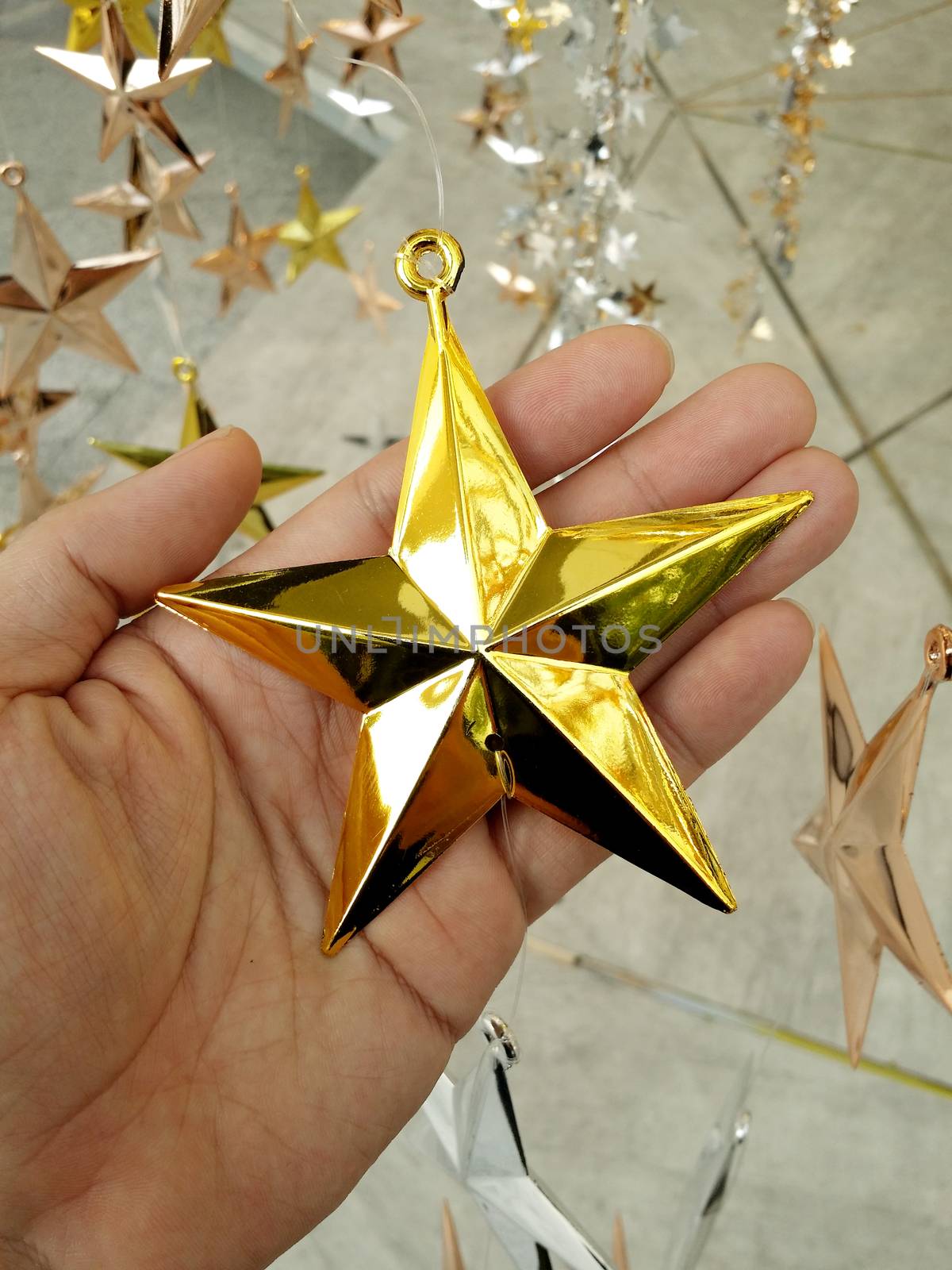 Man Hand and decoration star. by gnepphoto