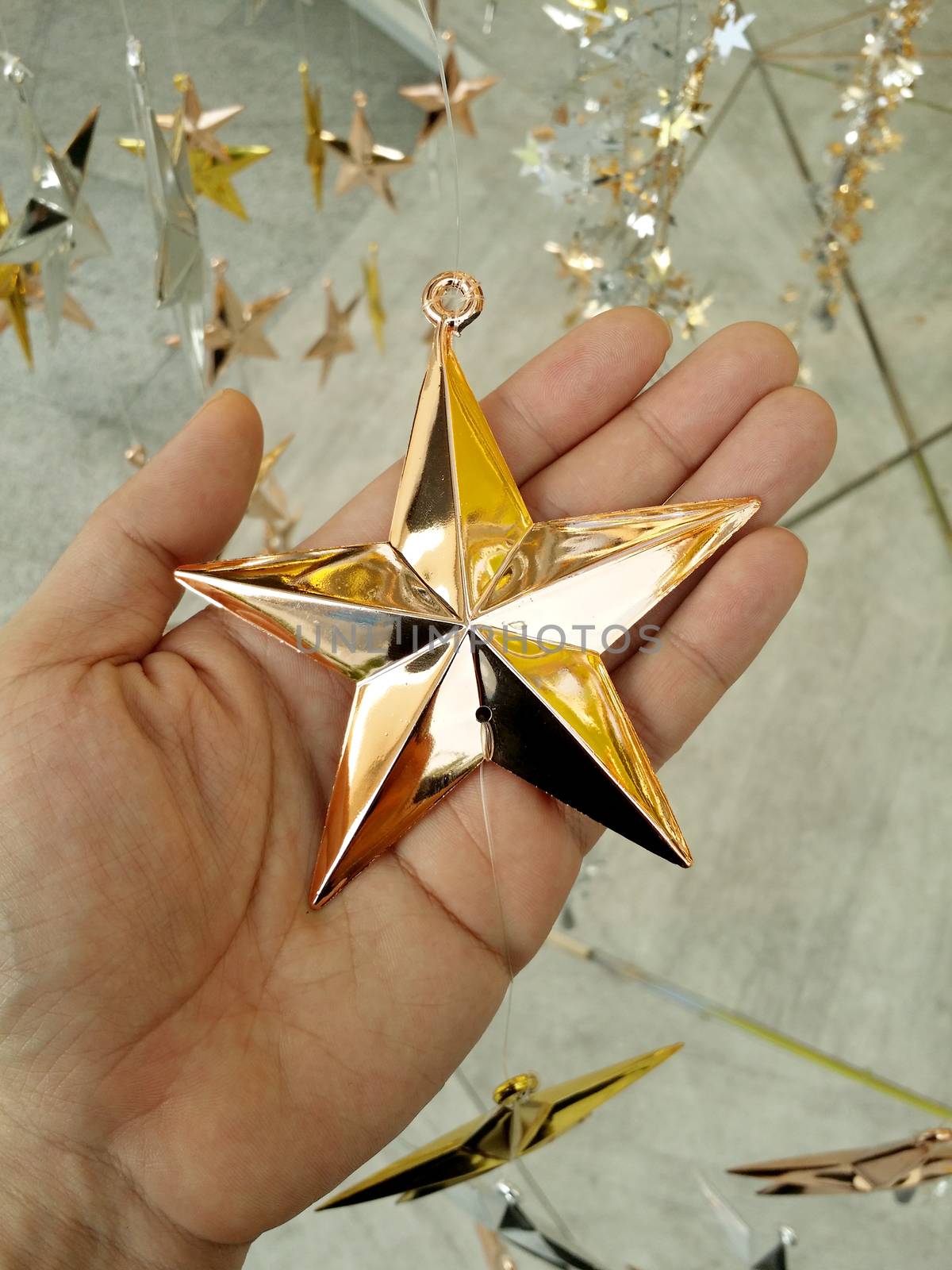 Man Hand and decoration star and Merry Christmas and Happy new years.