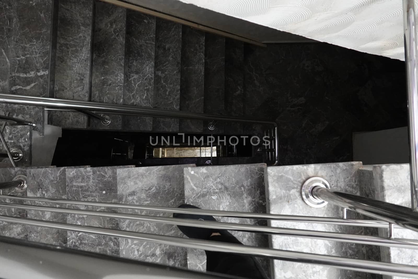 dark stairs with inox and marble.