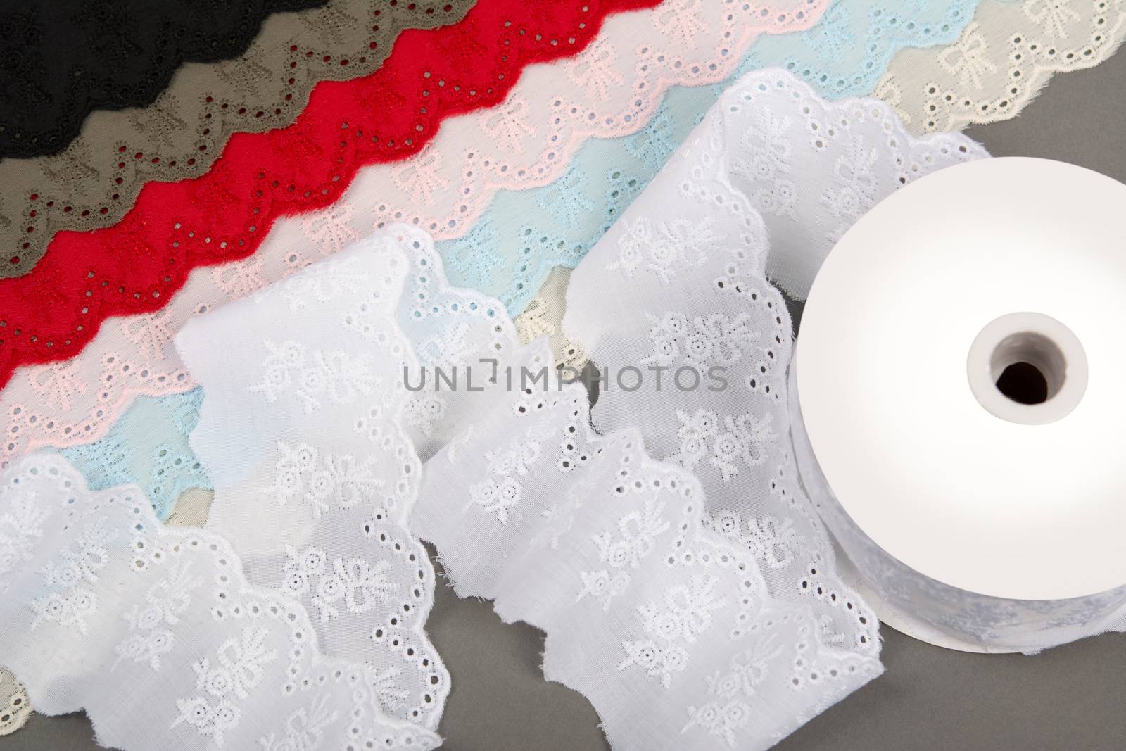 mockup label reel coil of color cotton natural tapes ribbon. Framing for clothing and traditional dresses in rustic style. Use for sew and tailor
