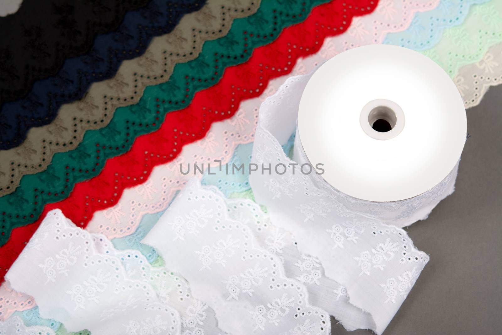 mockup label reel coil of color cotton natural tapes ribbon. Framing for clothing and traditional dresses in rustic style. Use for sew and tailor