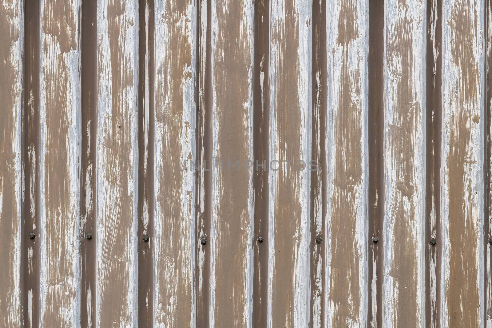 Background photo of brown sheet pile profiles on an old shed shown full-screen