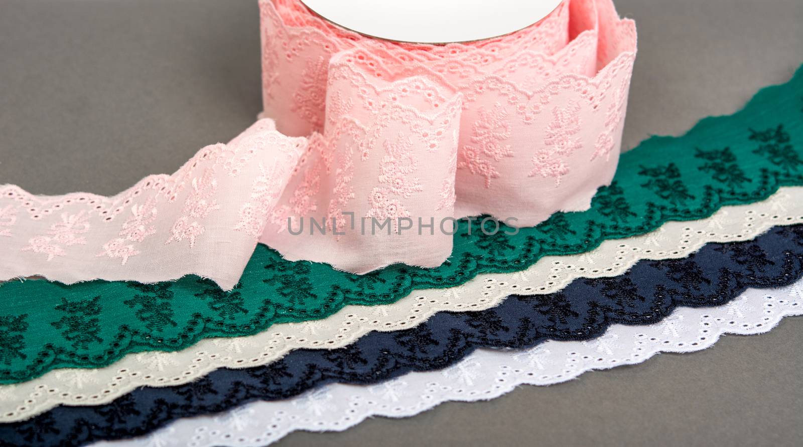 mockup label reel coil of color cotton natural tapes ribbon. Framing for clothing and traditional dresses in rustic style. Use for sew and tailor