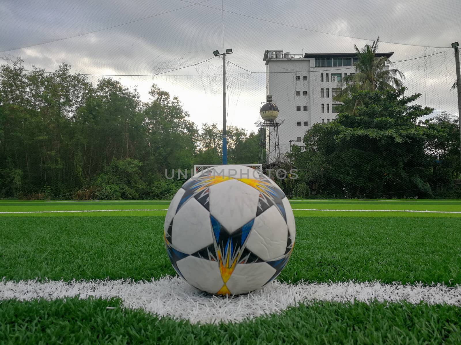 Football field, astro turf surface. Close up of throw in, kick off and corner area. Lushed green football pitch.