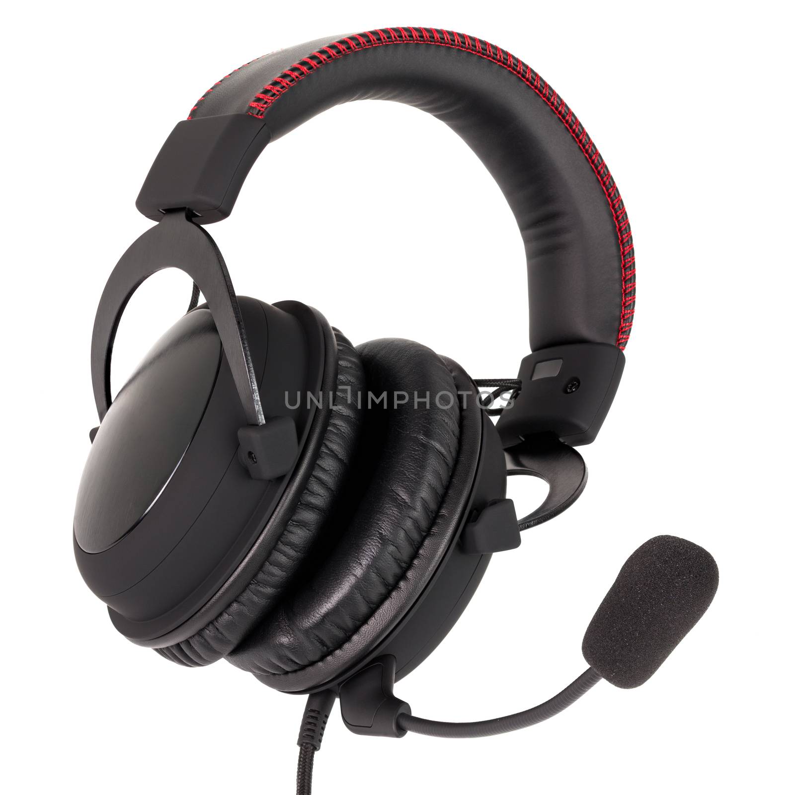 close view of wired black gaming headphones with microphone isolated on white background.