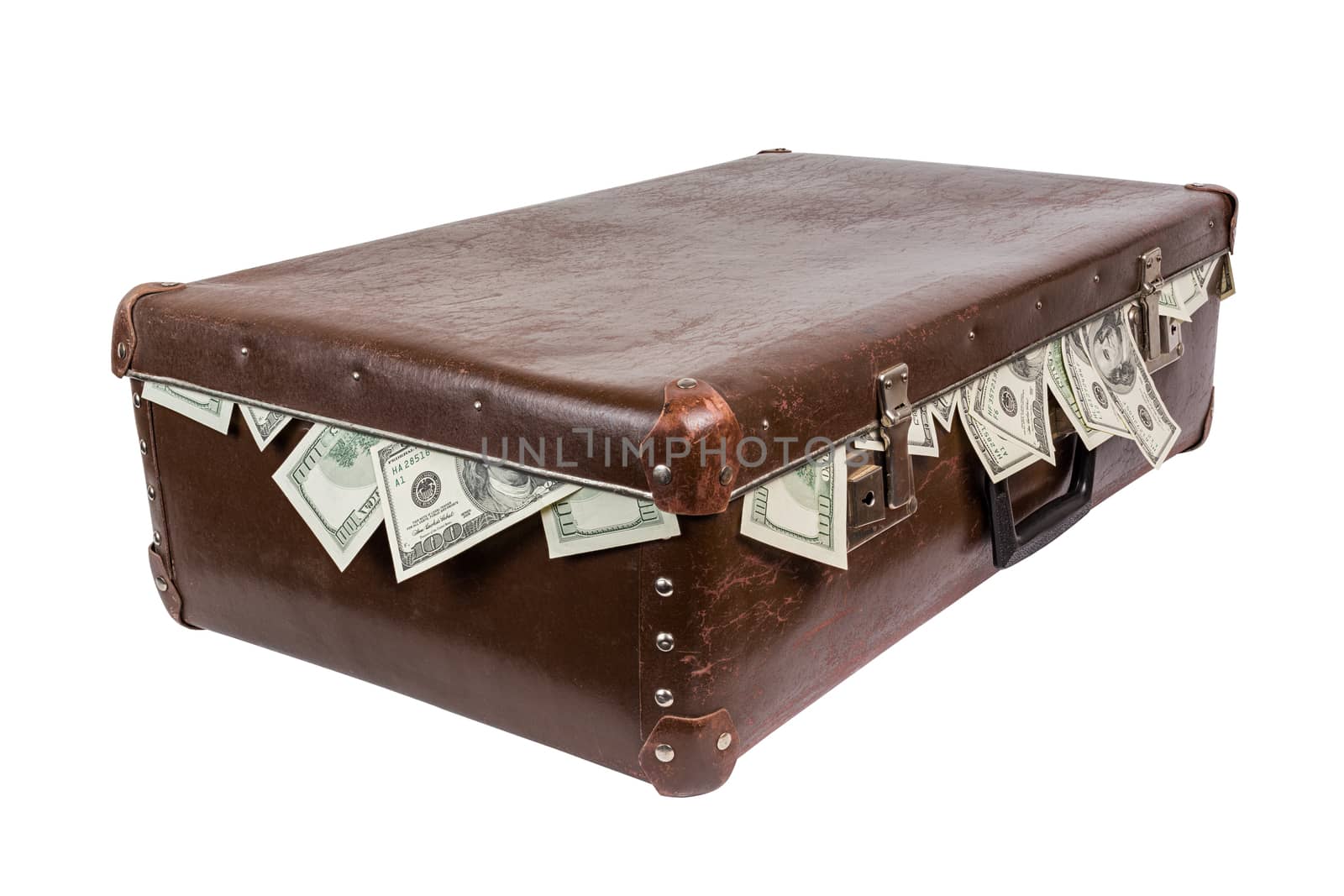 An old closed brown fiber suitcase with sticking out dollar banknotes. Laying on side and isolated on white background.
