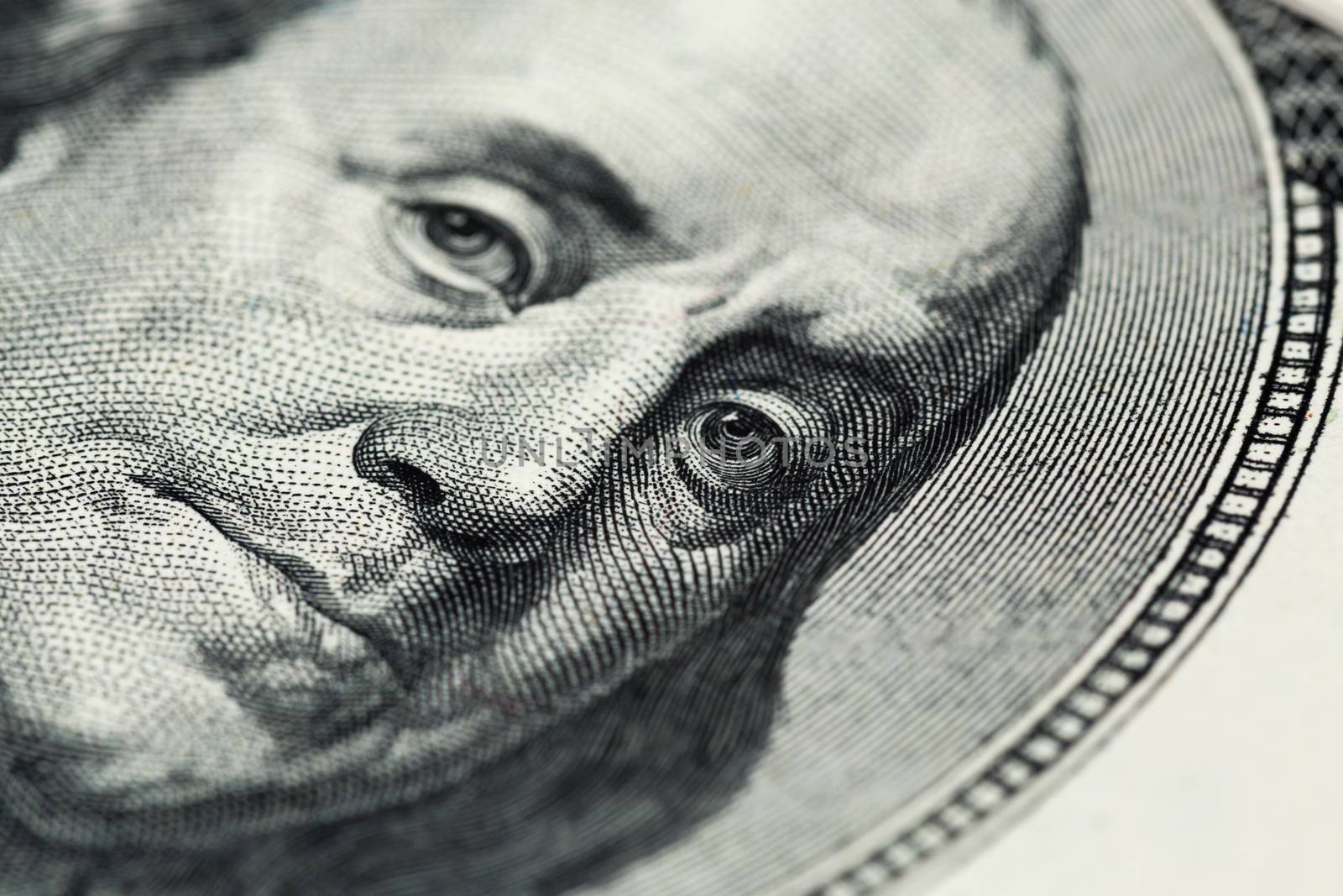 Boring close view of engraving portrait of Ben Franklin of old one hundred us dollars banknote. Selective focus with natural lens blur.