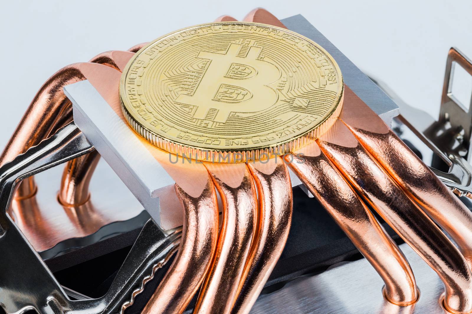 Bitcoin shiner cooling on modern tower heat radiator with six copper heatpipes.