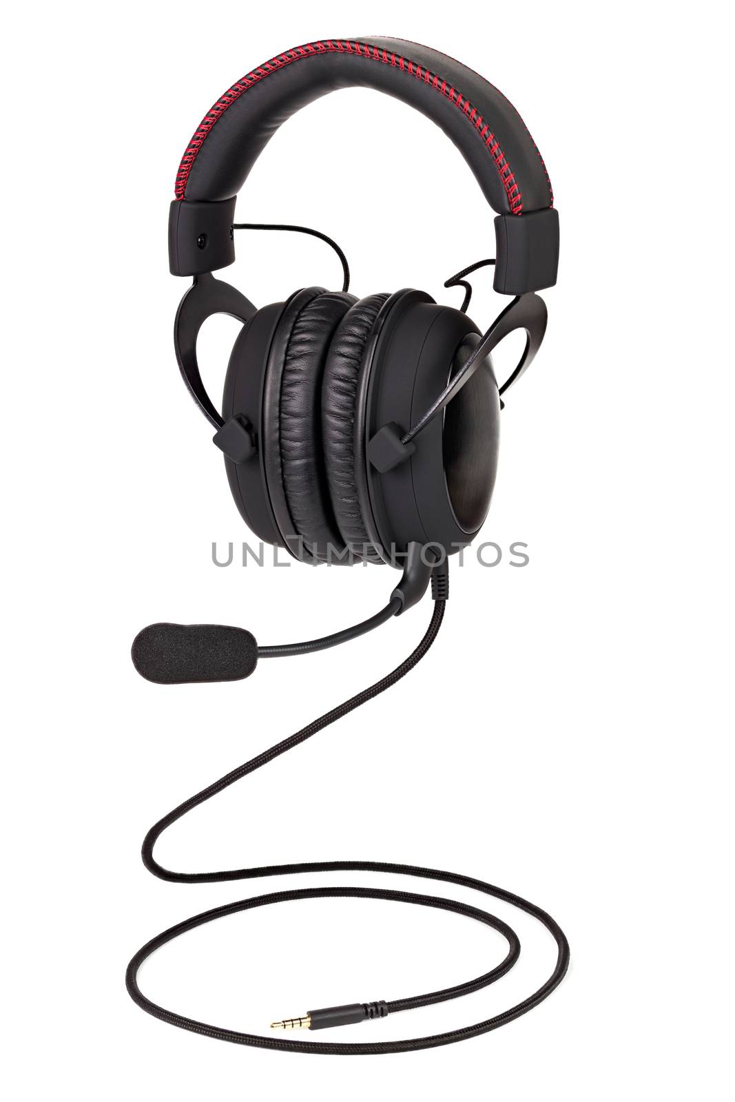 wired black gaming headphones with microphone isolated on white background flying over wire like a snake