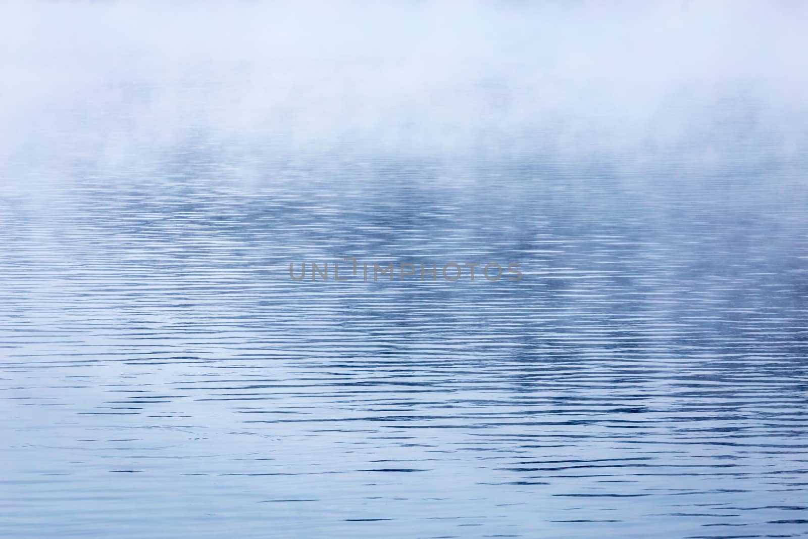 fog over water abstract background with selective focus and shallow depth of field.