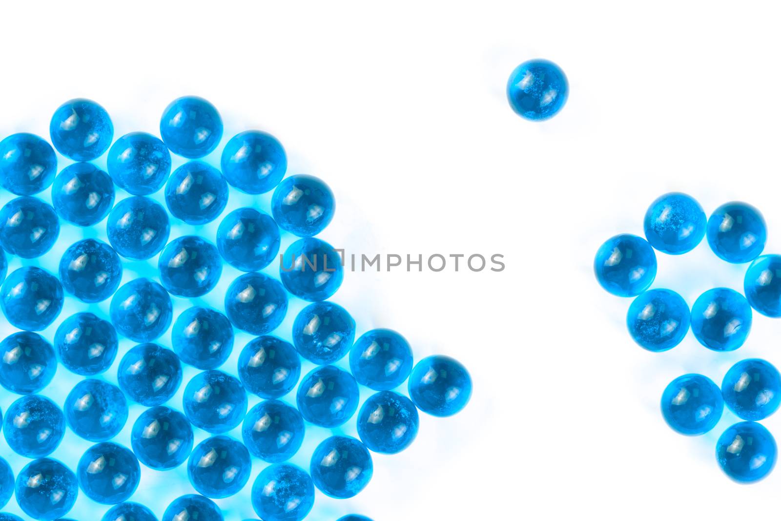 cyanspherical ball capsules with selective focus isolated on white background.