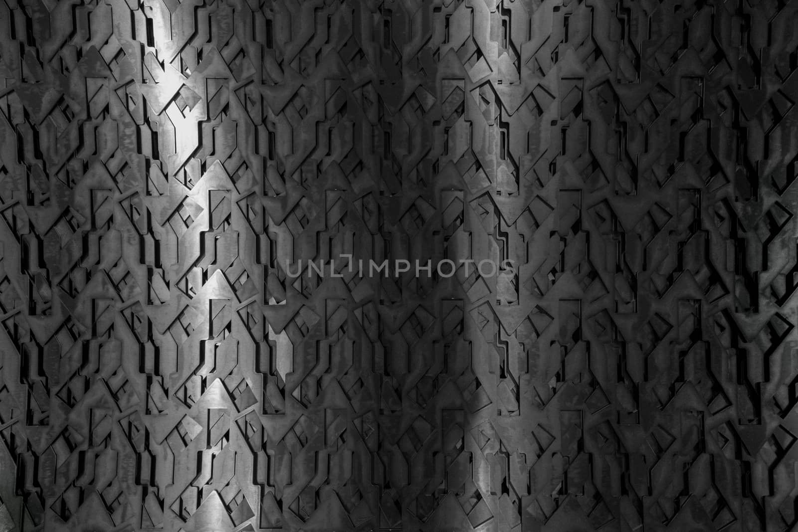 Light glow on grill pattern. Dark grainy industrial abstract background.