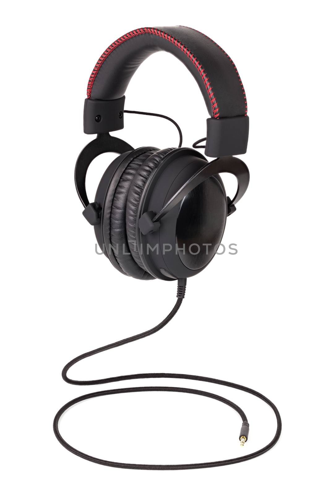 wired black professional headphones isolated on white background flying over wire like a snake