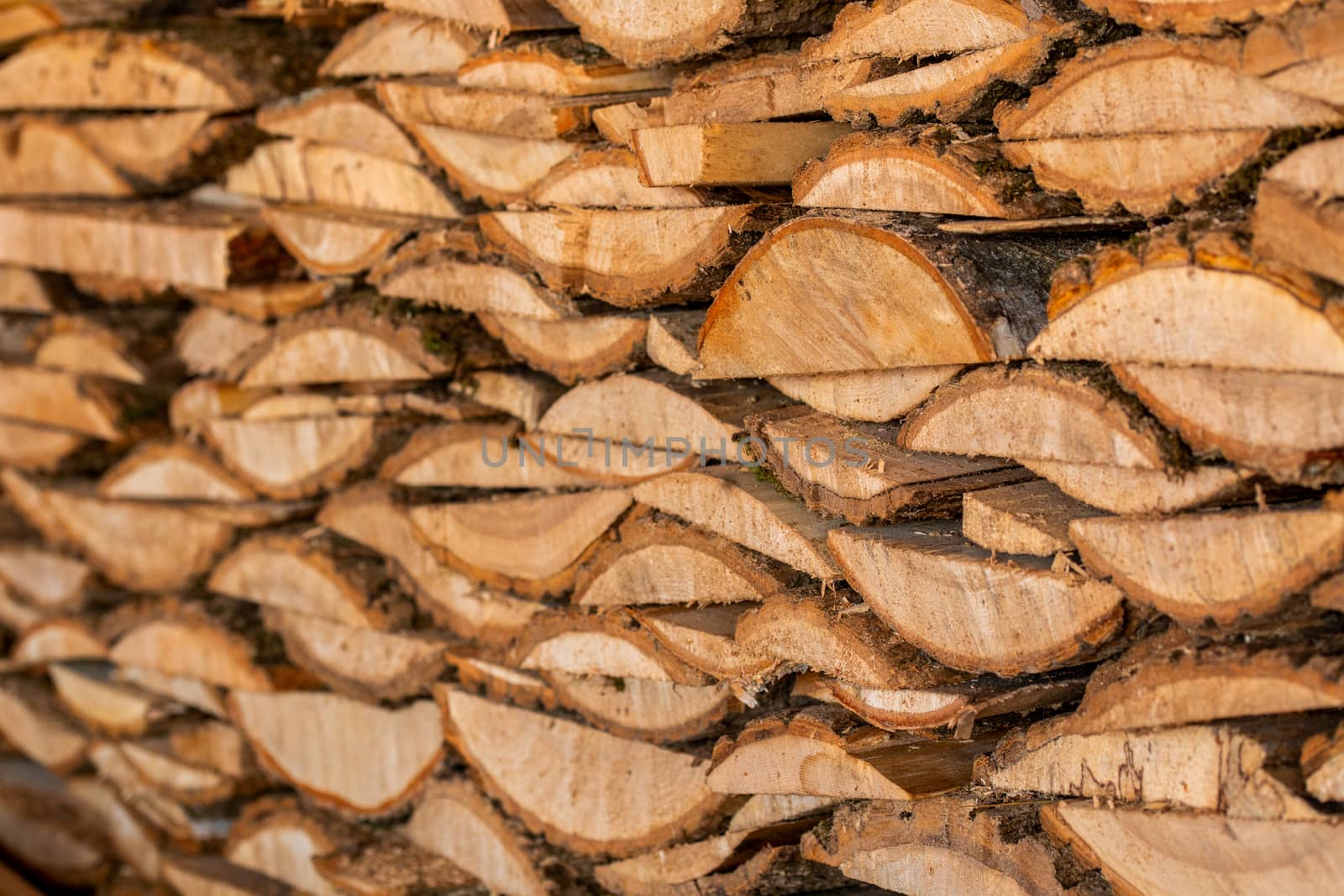 closeup background of firewood lumber leftovers stack with selective focus.